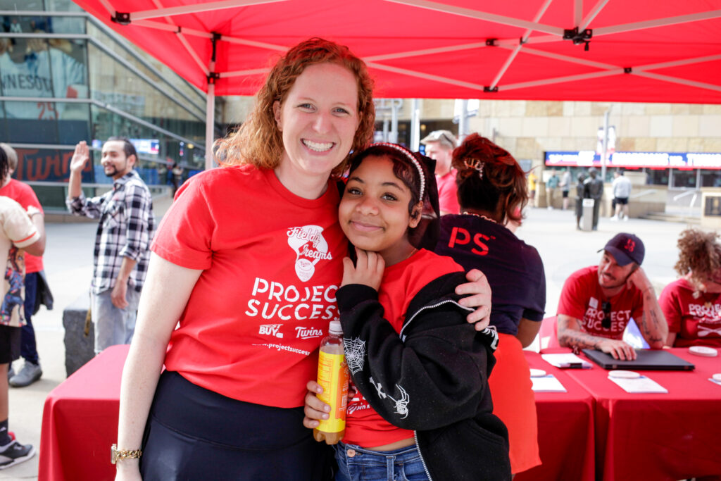 PS staff member and student smiling for the camera.