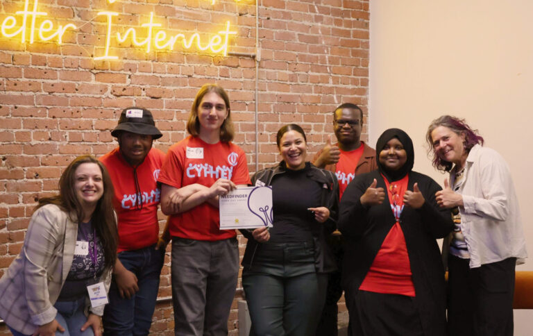 Students posing with Needfinder Award and Kulture Klub Collaborative staff.