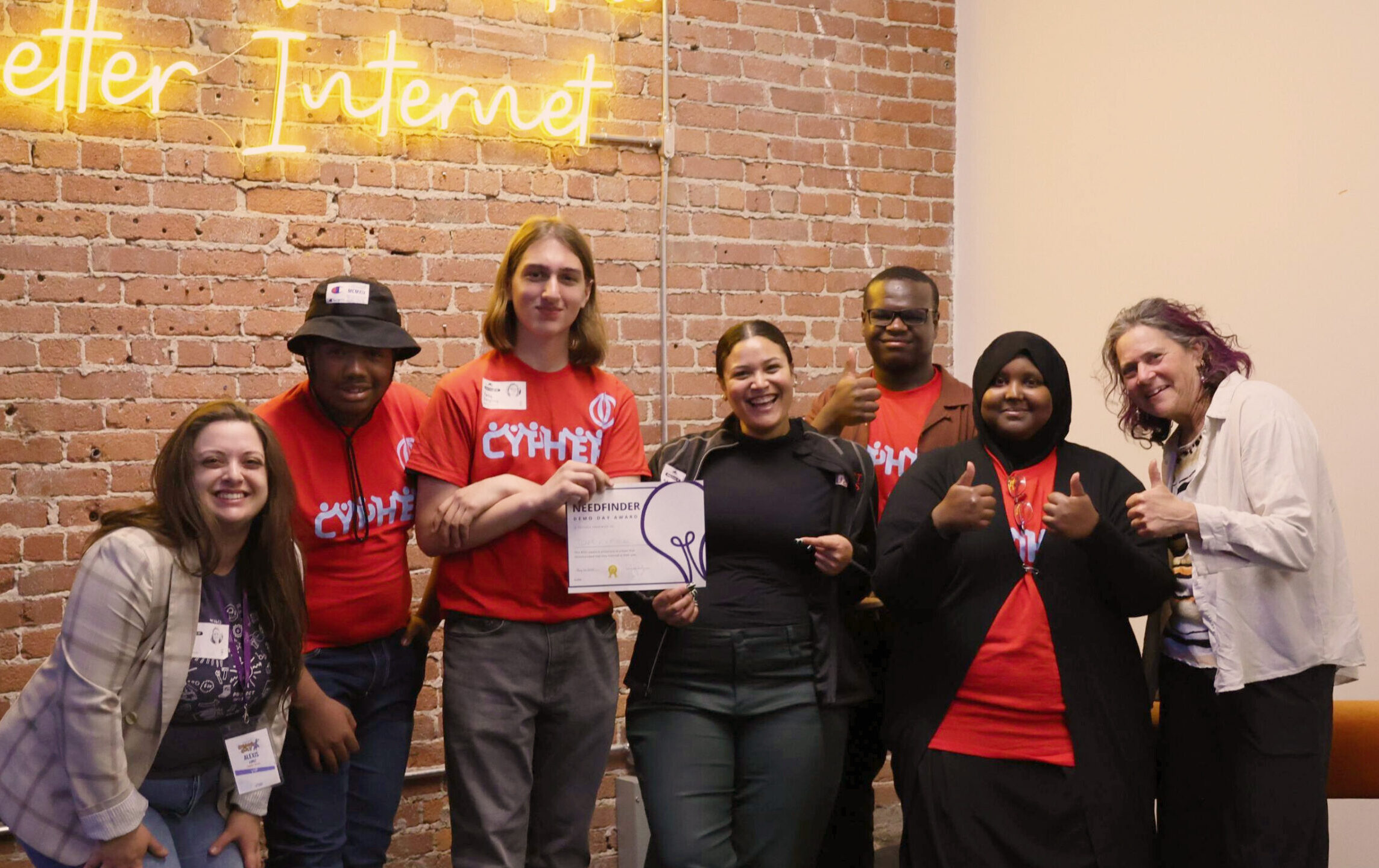 Students posing with Needfinder Award and Kulture Klub Collaborative staff.