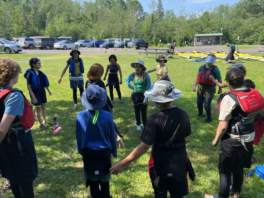 Students in a circle playing a game.