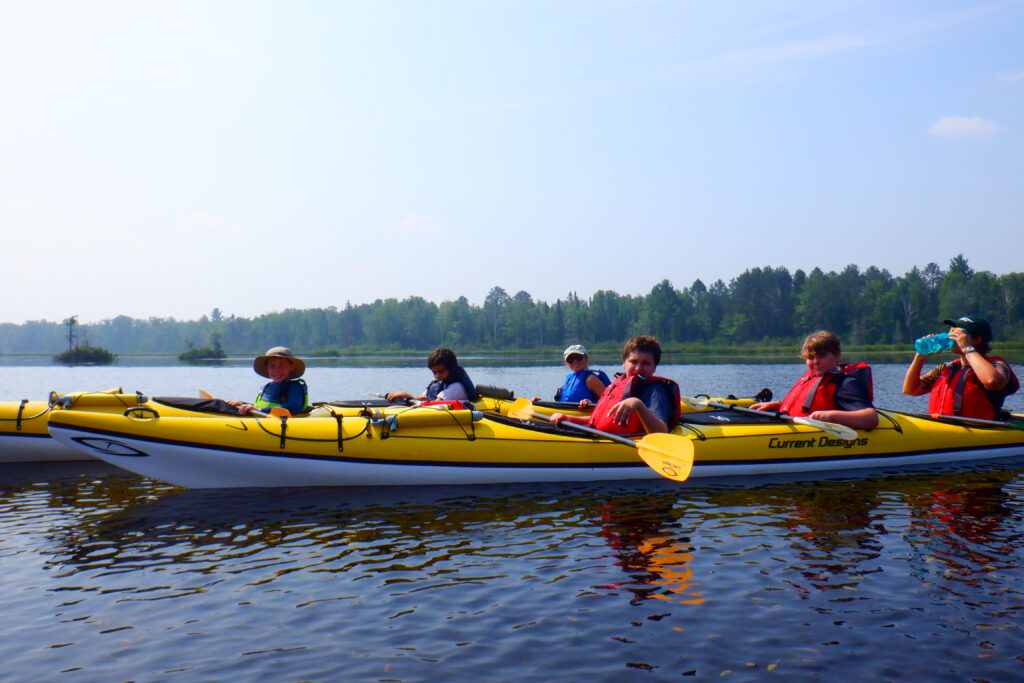 Students in kayaks.