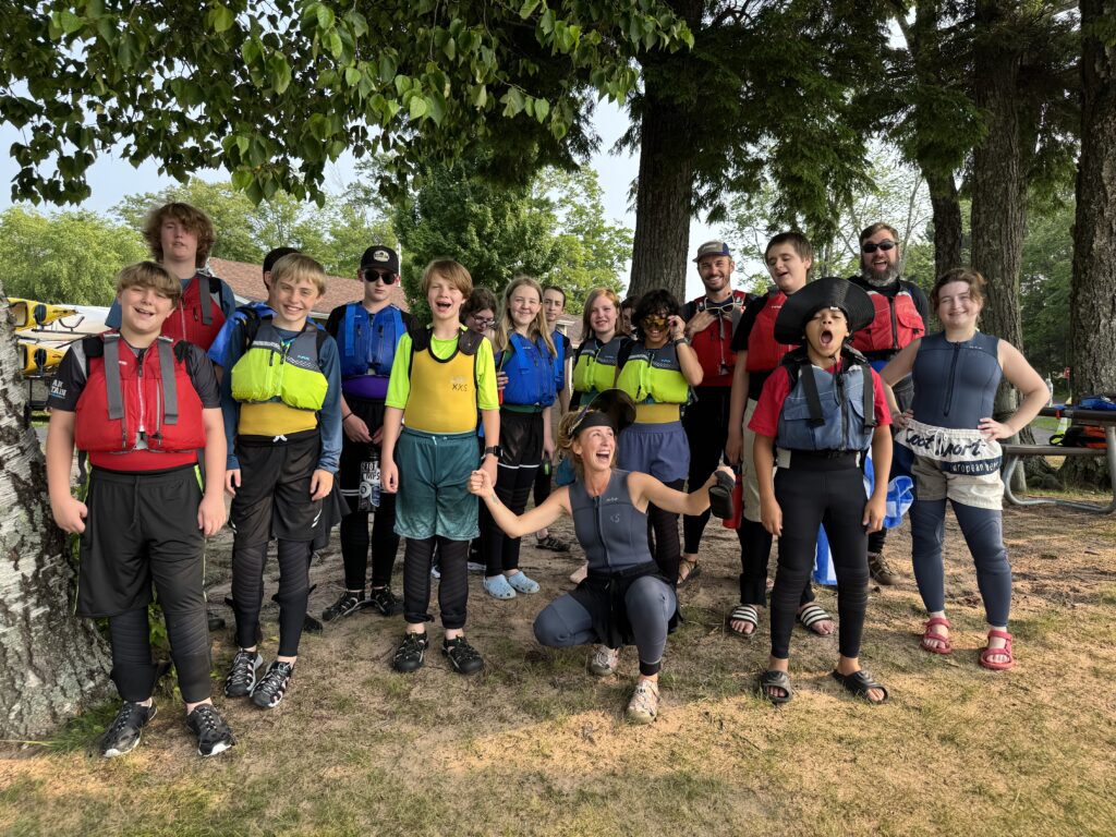 Apostle Island students standing and smiling together.