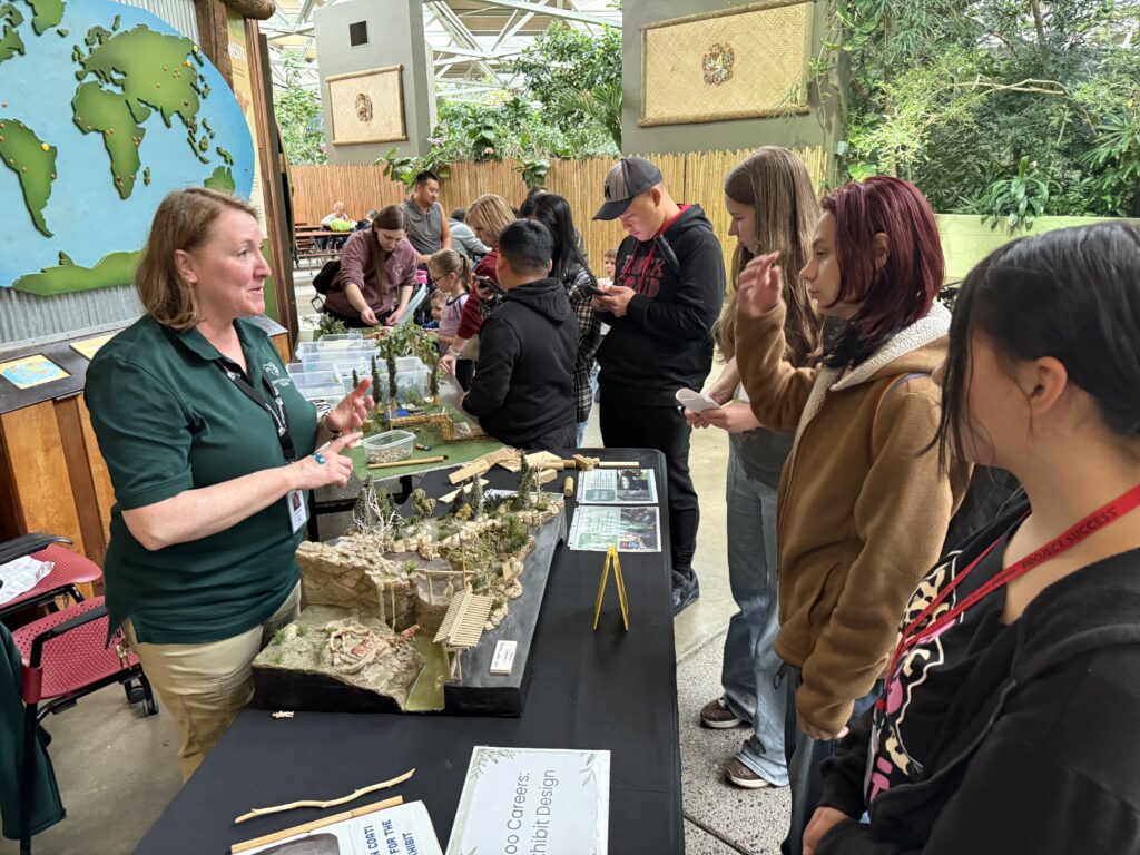 Students learning from a zoologist.