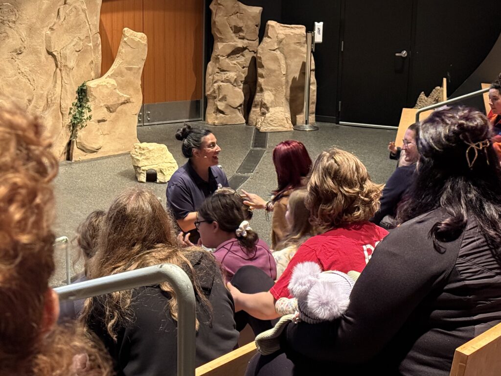 Students learning from a zoologist.