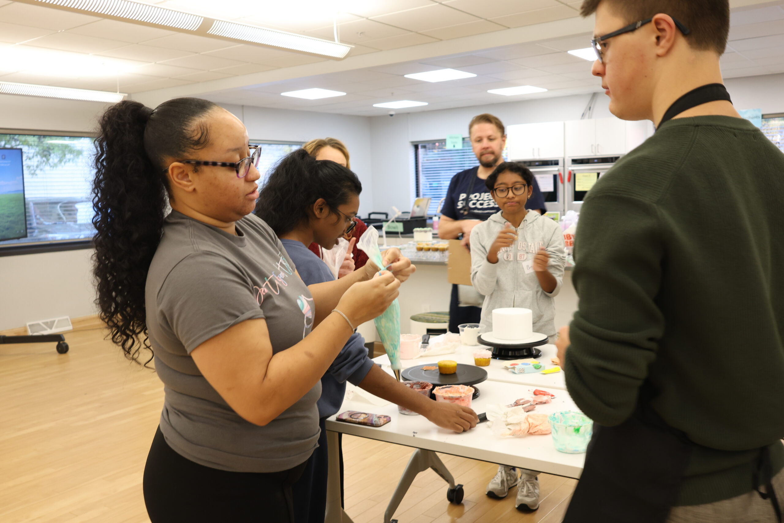 Instructor demonstrating frosting technique.