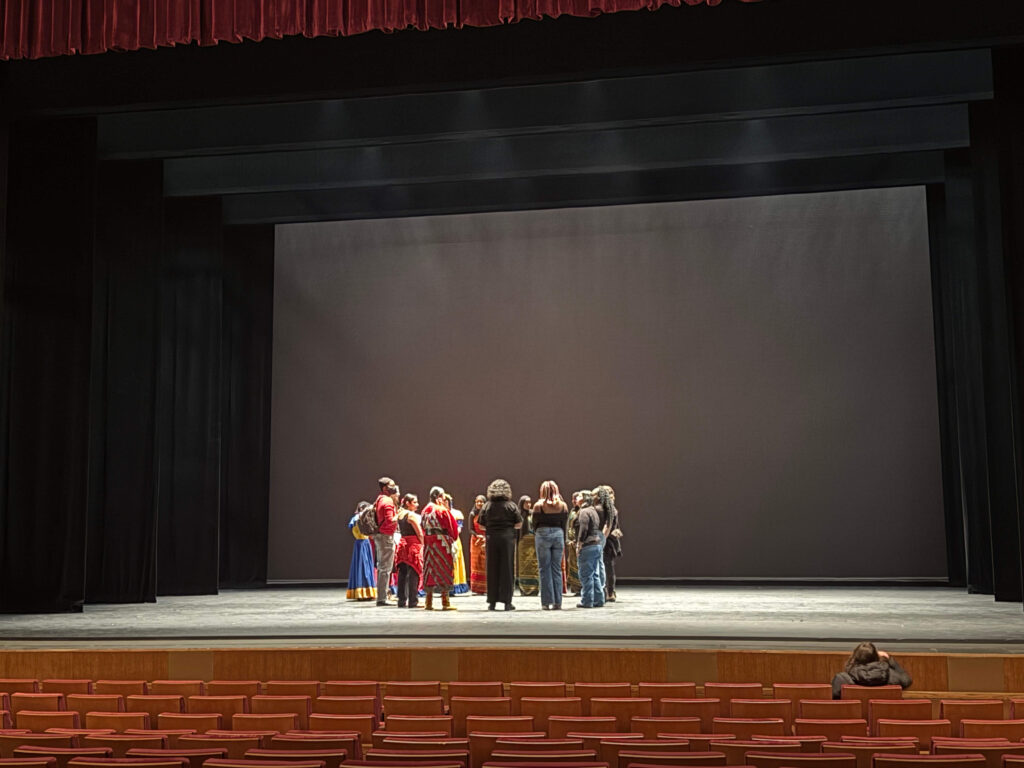 Group huddle of performers.