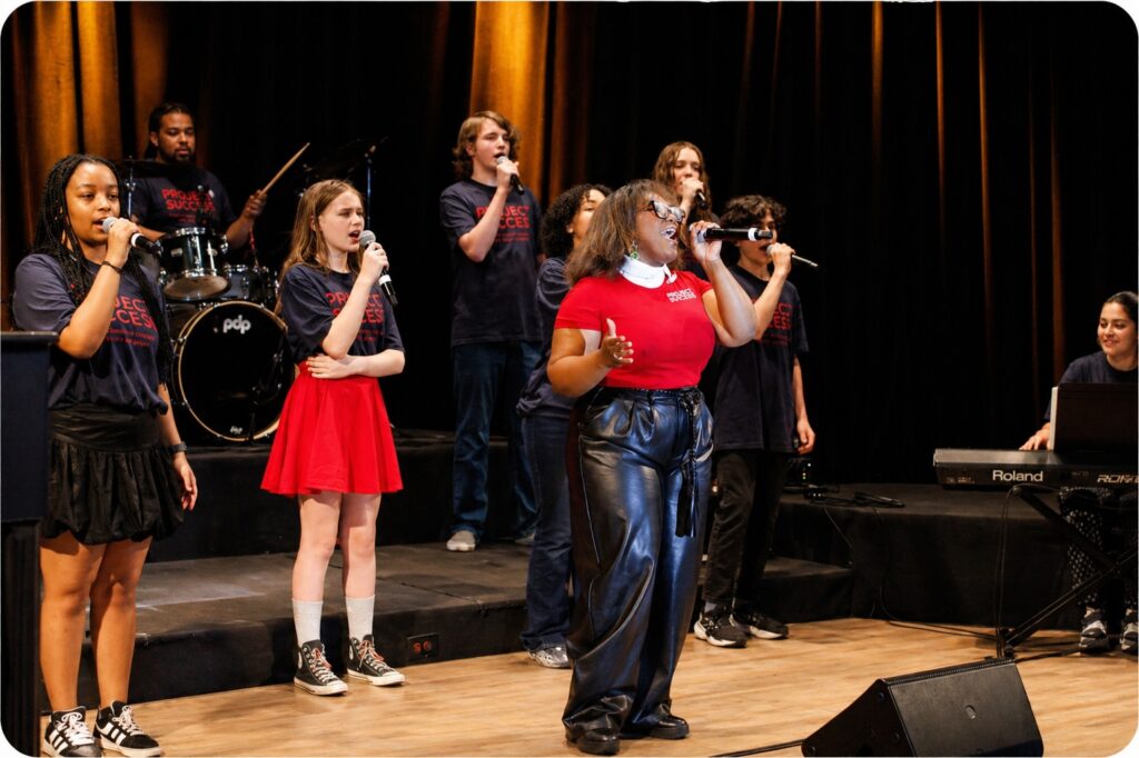 Taliah and students singing.