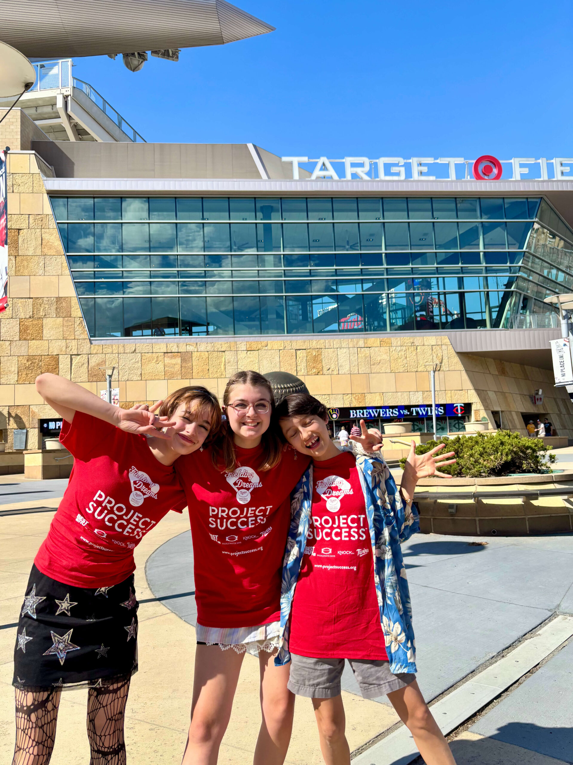 Students smiling outside of Target Field.