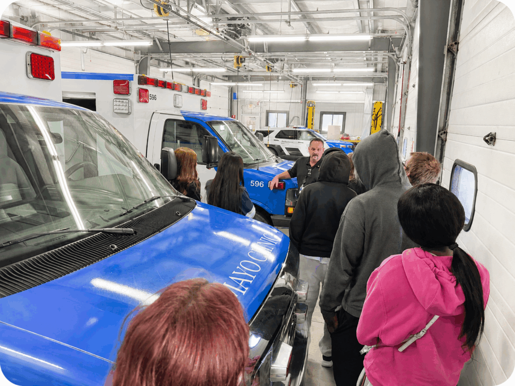 Students exploring ambulance station at Mayo Clinc.