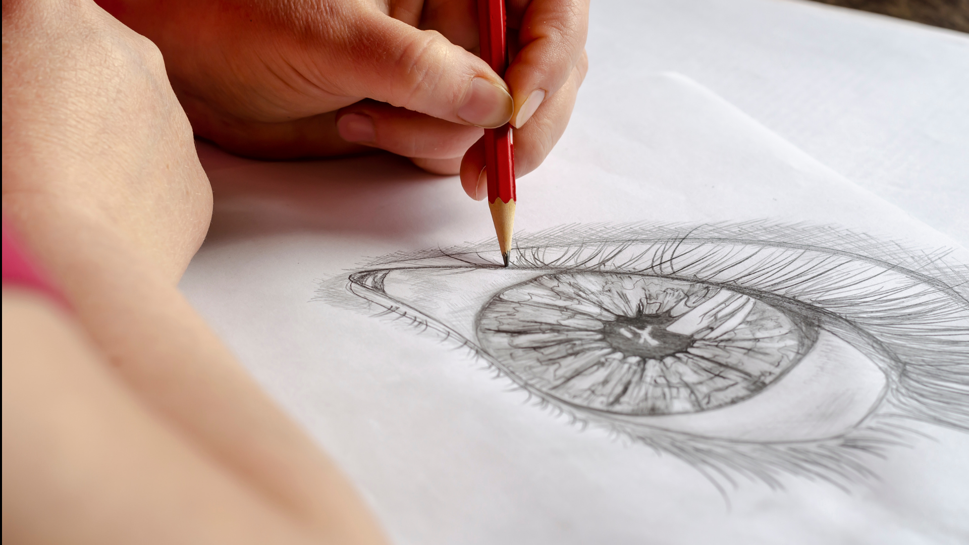 Student drawing an eye with a pencil